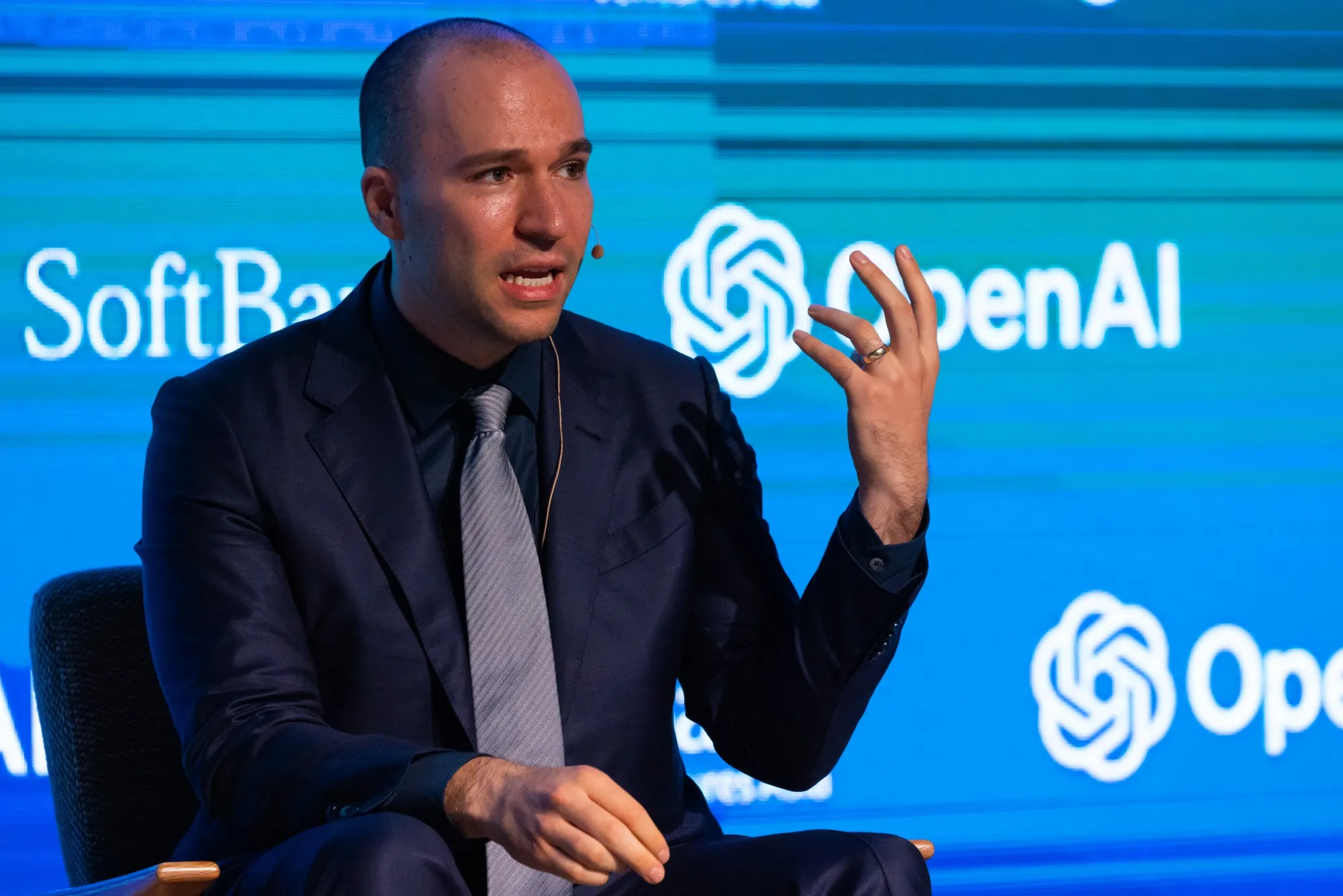 Greg Brockman speaking at an OpenAI event